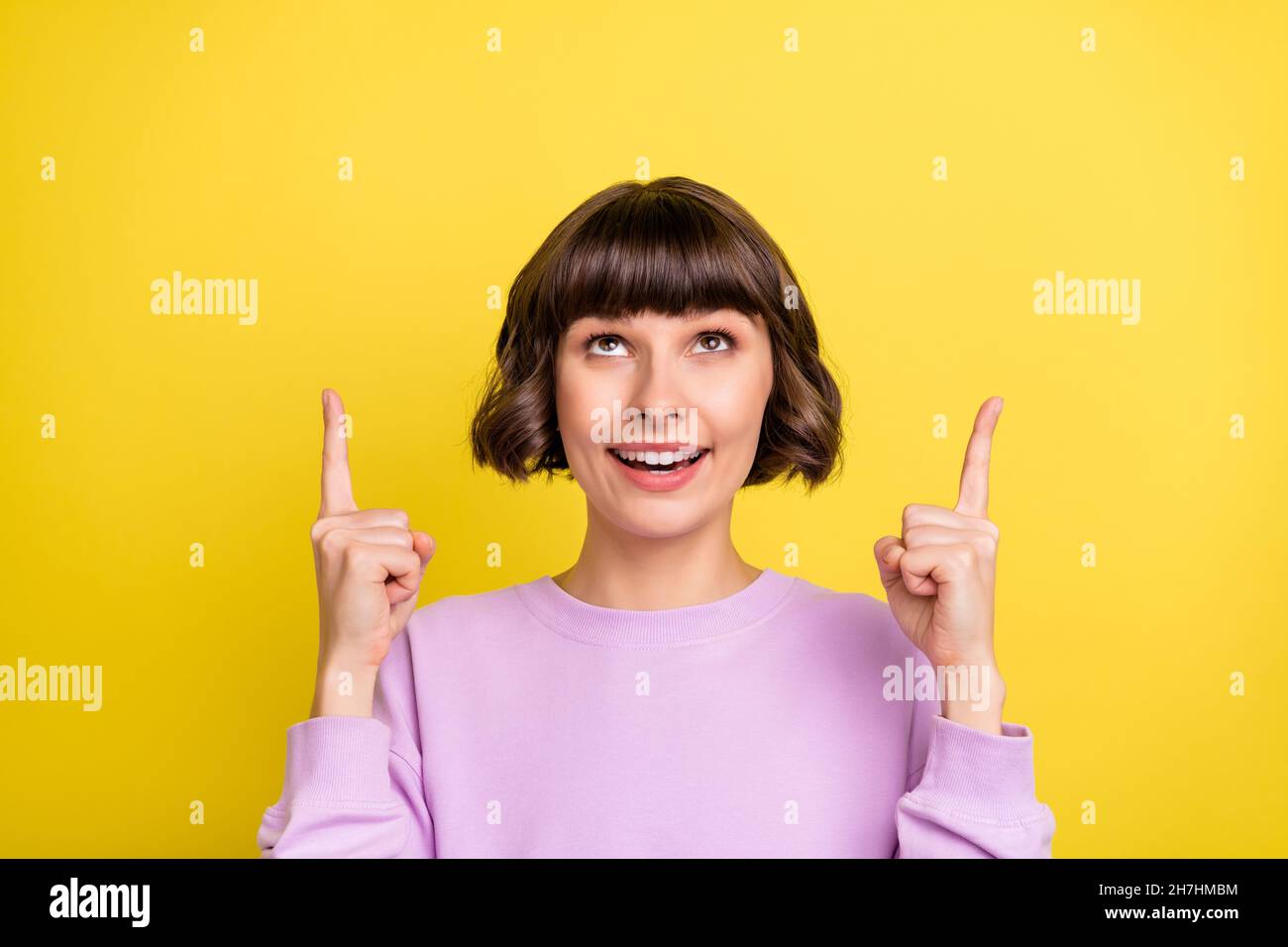 Portrait Of Attractive Curious Cheerful Girl Demonstrating Up Copy