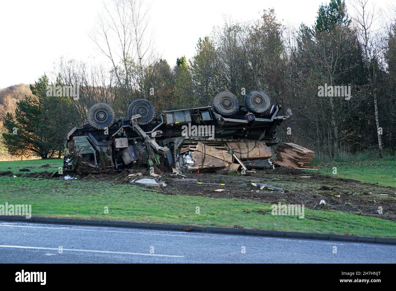 An overturned army vehicle sits in the middle of the Keir roundabout on
