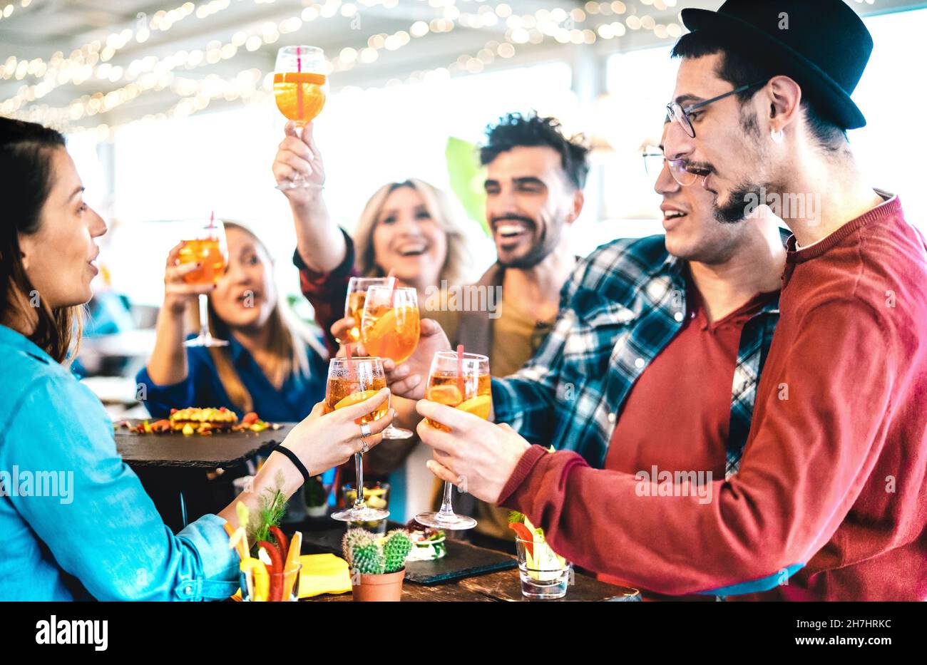 Friends group having fun at pre dinner party aperitif buffet drinking cocktails and eating snacks - Life style concept with young people Stock Photo