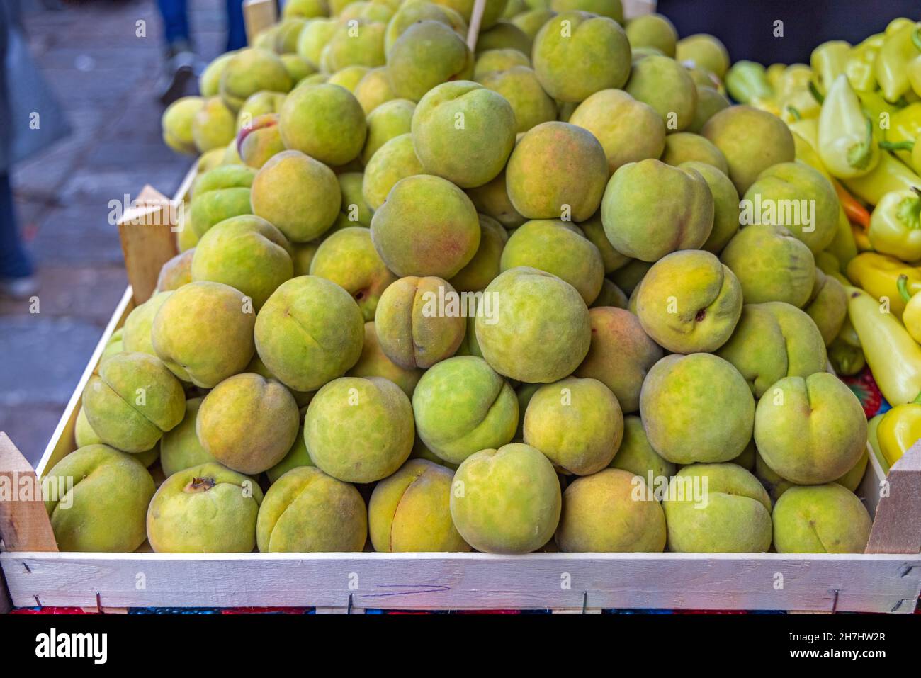 Green Peaches Immature Not Yet Ripe Fruits in Crate Stock Photo - Alamy