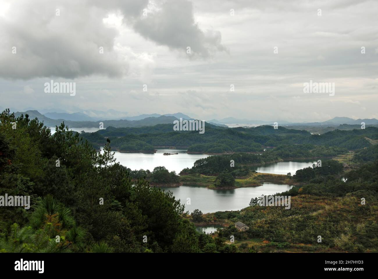 Qiandao Hu, Zhejiang Province, China: View of the lake and islands with foreground forest. Qiandao Hu translates as Thousand Island Lake. Stock Photo