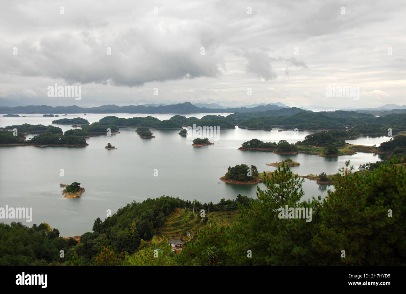 Qiandao Hu, Zhejiang Province, China: View of the lake and islands with foreground forest. Qiandao Hu translates as Thousand Island Lake. Stock Photo
