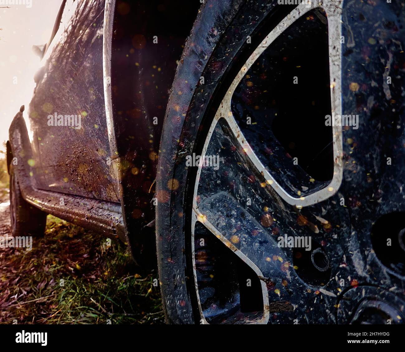 Concept image of the dirty front wheel of SUV and its side door