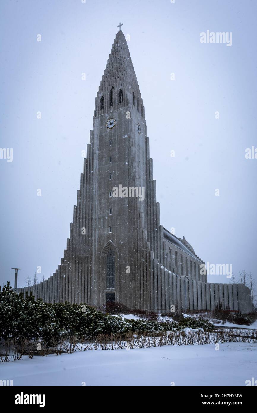 Reykjavik, Iceland - April 07, 2021: Hallgrimskirkja church in Reykjavik downtown during the winter snow storm. Stock Photo