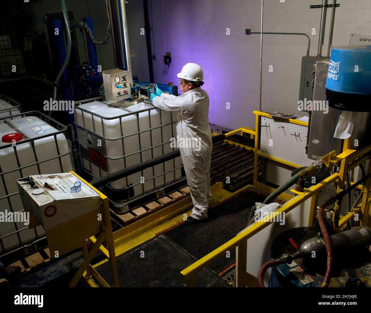Worker in industrial chemical manufacturing facility, Philadelphia, USA Stock Photo