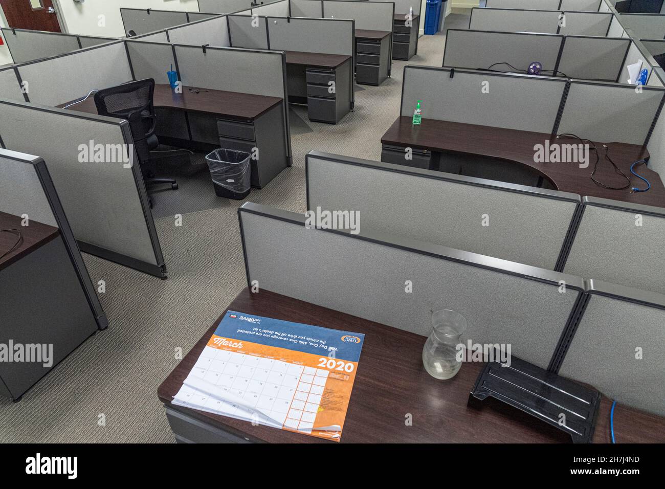 A calendar with the date March 2020, the start of the pandemic, showing in empty office workplace, Philadelphia Pennsylvania, USA Stock Photo