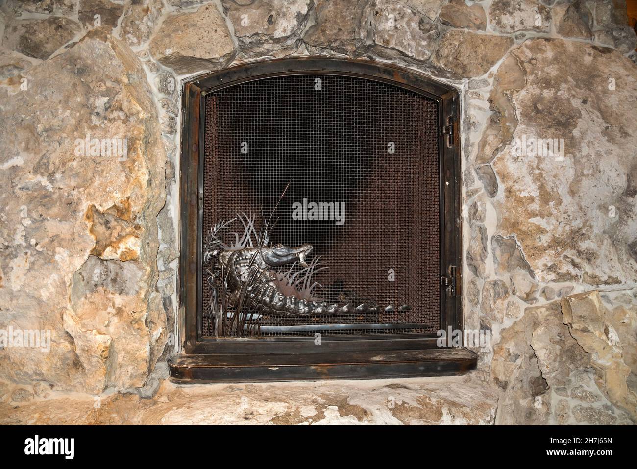 Beautifully crafted and massive stone fireplace surrounded by animals