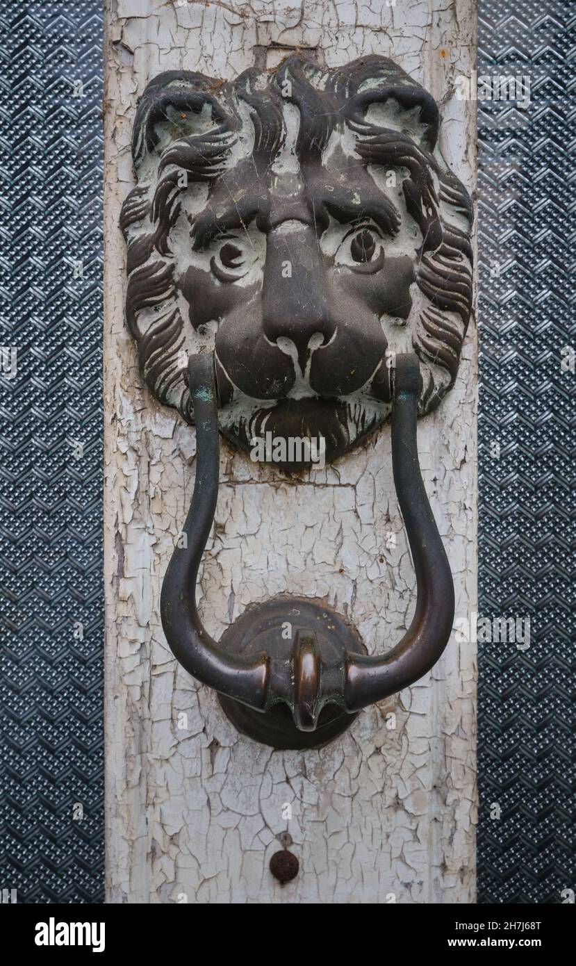 lion-head door knocker on an old house Stock Photo