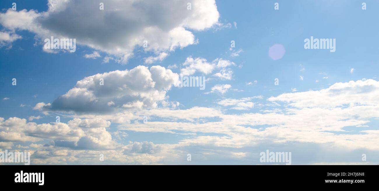 White fluffy clouds in blue sky, aerial view background Stock Photo - Alamy