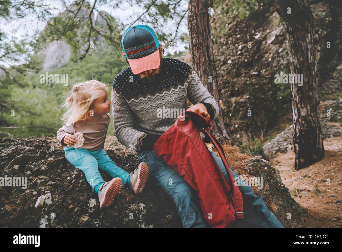 Family father and daughter child in forest travel with backpack camping
