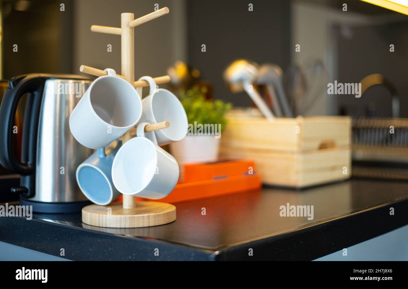 Hanging grass cookware set on table in wooden box Stock Photo