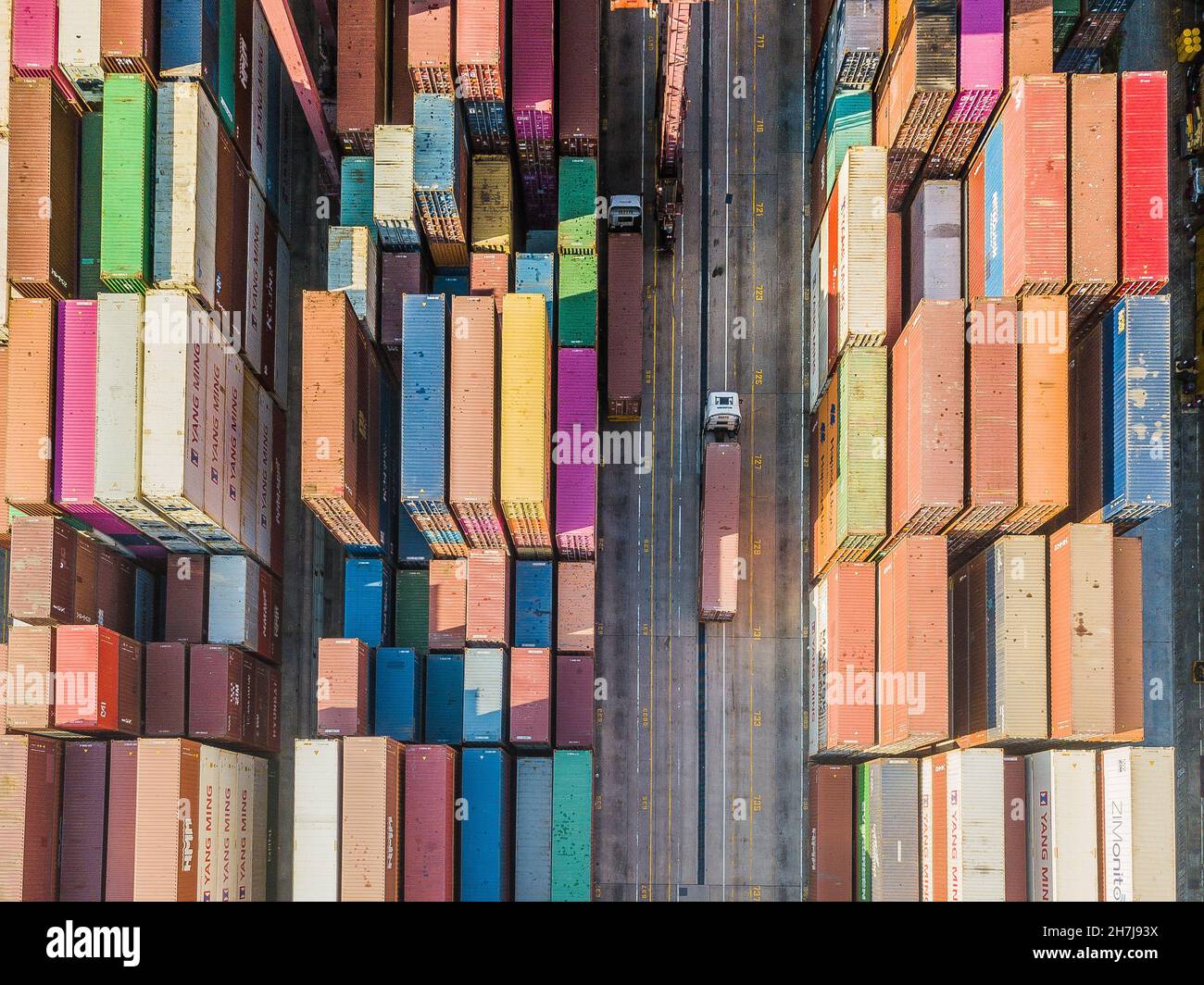 Hong Kong, China, 13 Nov 2021, Two trucks pass in the Kwai Chung Container port. Stock Photo