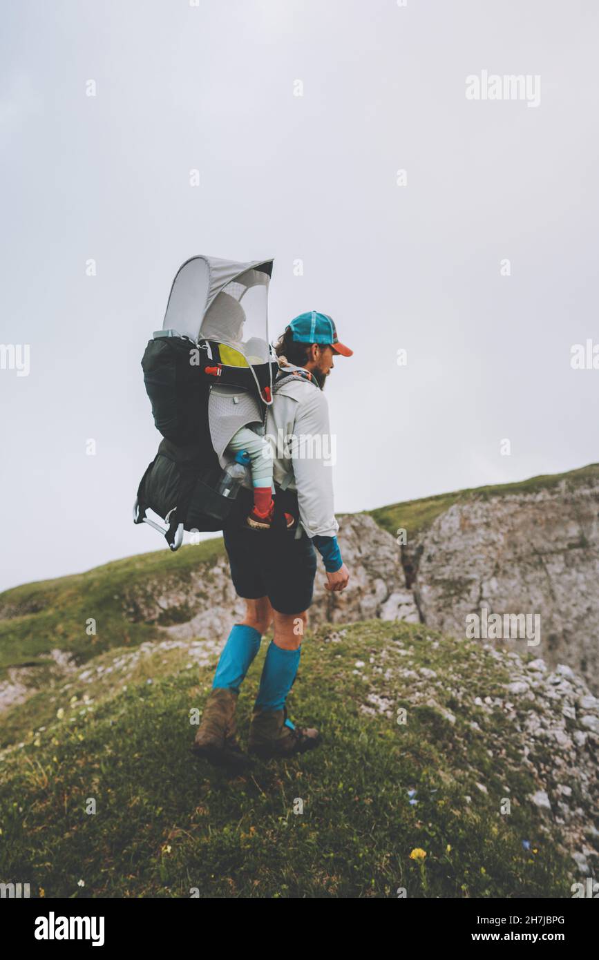 Couple hiking travel with baby in backpack family vacation in mountains man  and woman outdoor healthy lifestyle eco tourism summer trip Stock Photo -  Alamy