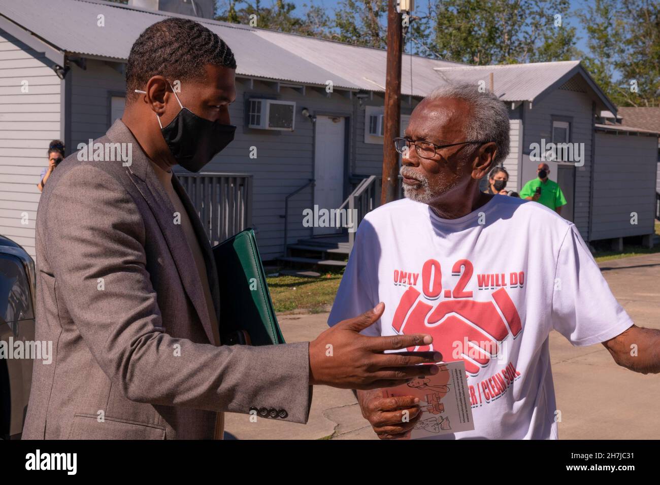 New Orleans, United States of America. 16 November, 2021. U.S. EPA Administrator Michael Regan, left, speaks with St. John the Baptist resident Robert Taylor during a tour of neighborhoods effected by high levels of industrial pollution known as Cancer Alley, during his Journey to Justice tour November 16, 2021 in New Orleans, Louisiana.  Credit: Eric Vance/U.S. EPA/Alamy Live News Stock Photo