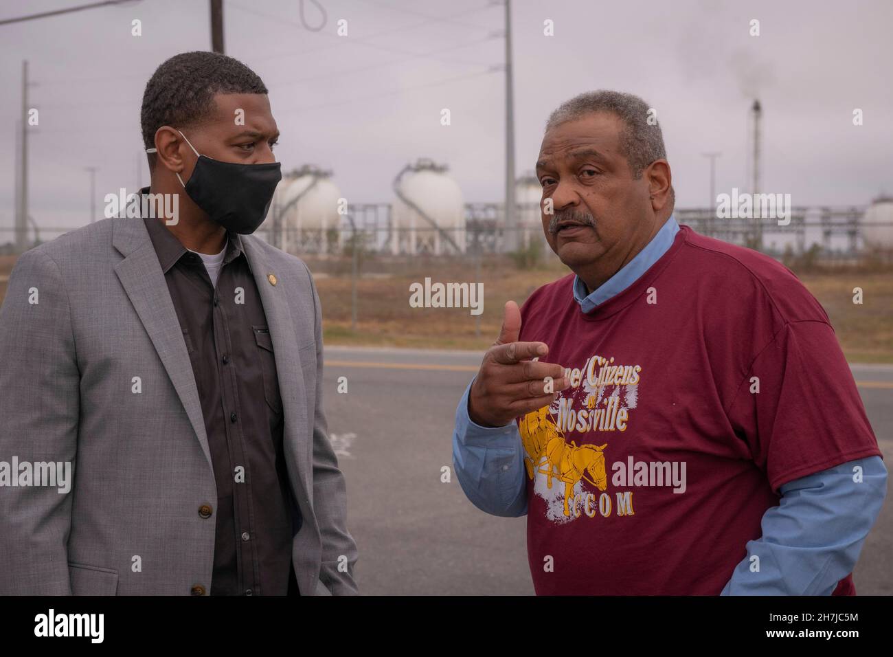 Mossville, United States of America. 18 November, 2021. U.S. EPA Administrator Michael Regan, left, speaks with resident Karl Prater during a tour of neighborhoods effected by high levels of industrial pollution known as Cancer Alley, on is Journey to Justice tour November 18, 2021 in Mossville, Louisiana.  Credit: Eric Vance/U.S. EPA/Alamy Live News Stock Photo