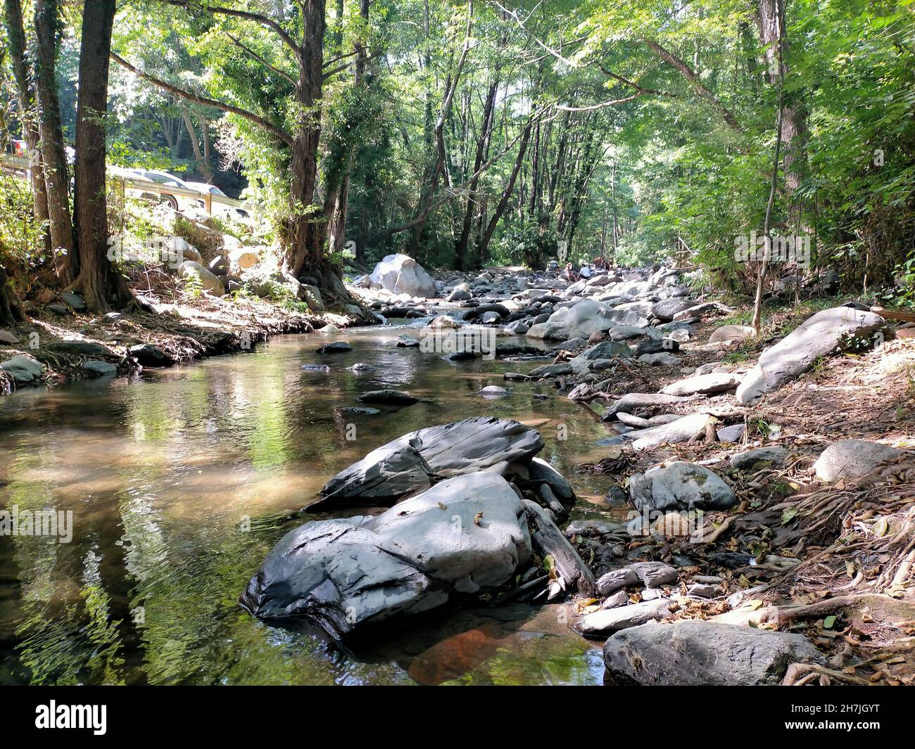 River Parted By Rocks Stones and rocks in a river at the daytime Stock Photo - Alamy