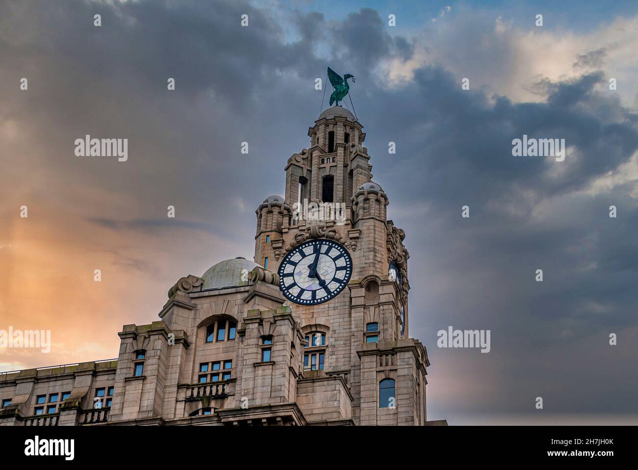 The Royal Liver Building with bird statue on dome against cloudy sky Stock Photo