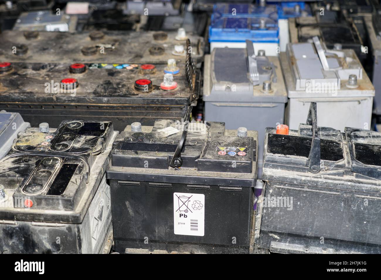 used car batteries waiting to be recycled in environmentally harmful scrap yard Stock Photo - Alamy