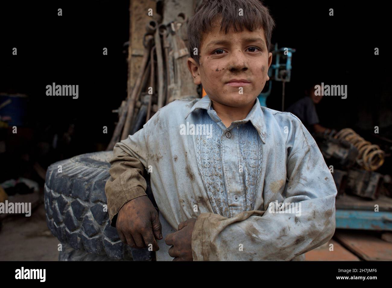 Zaini, 10, outside his father's auto repair shop, in the city of  Mazar-e-Sharif, in the northern province of Balkh. He has completed third  grade and l Stock Photo - Alamy