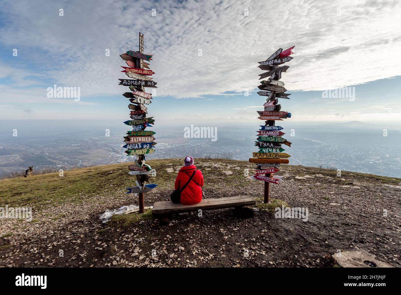 Caucasus, Pyatigorsk, Russia: Landscape on the mountain post with pointers cities and wooden bench on the peak Stock Photo