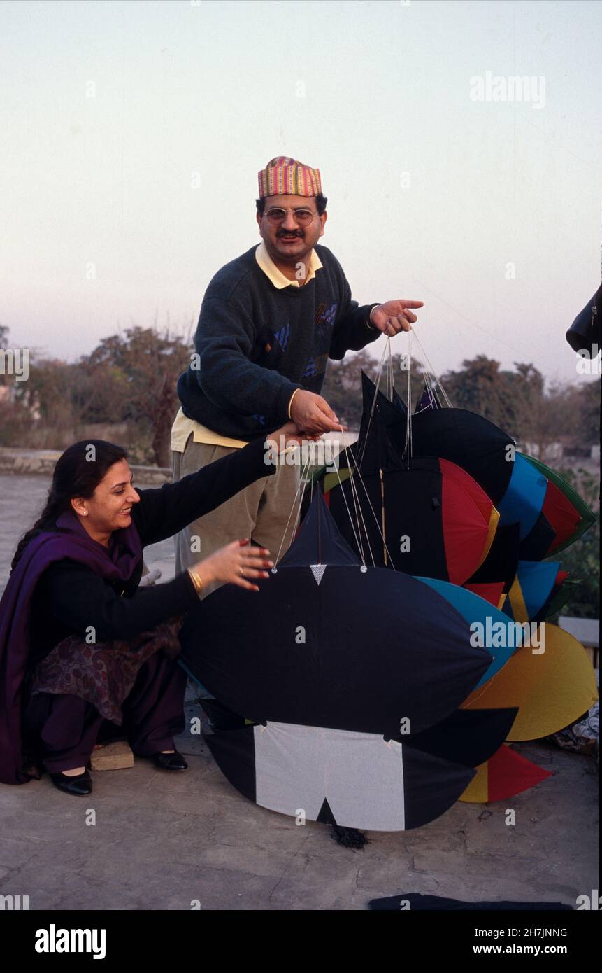 A Punjabi family arranges their kites on their rooftop, during Basant