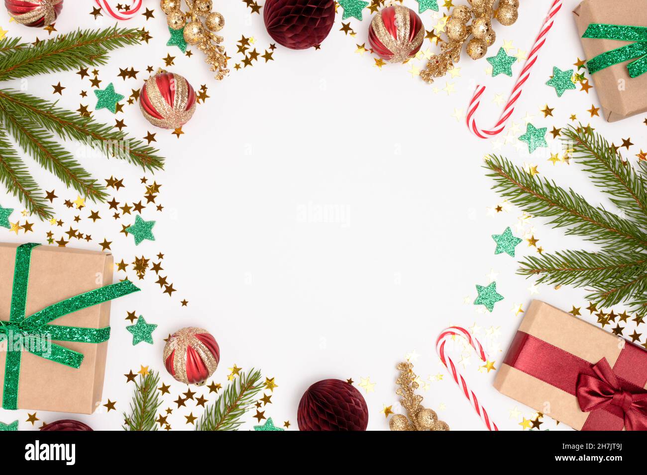 Round frame made of Christmas decorations and fir tree branches on a ...