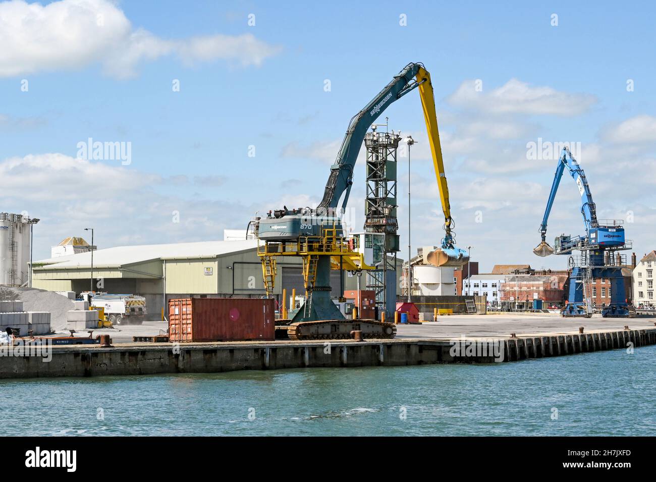 Poole, Dorset, England June 2021 Large mobile cranes with buckets in