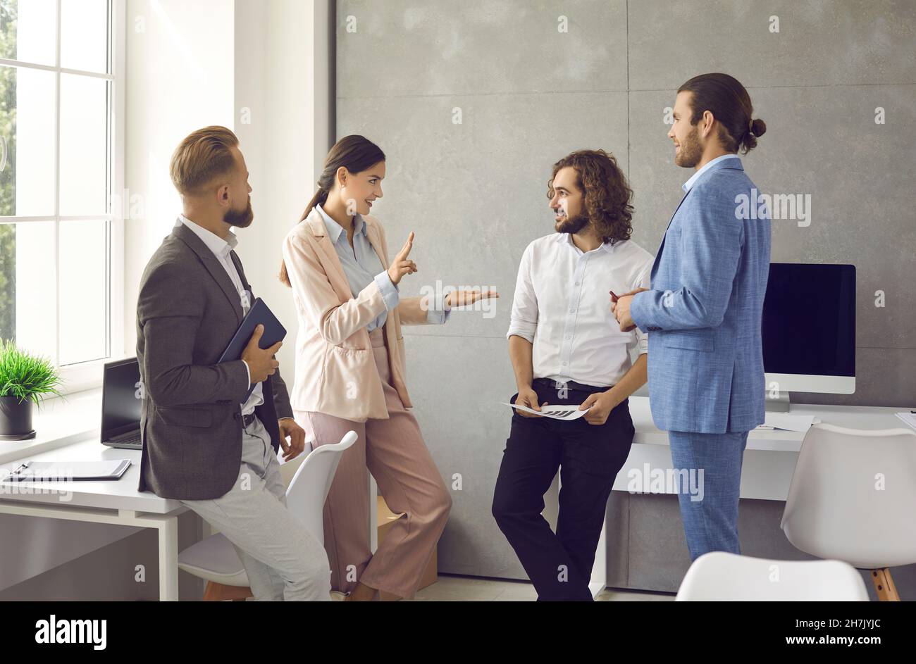 Team of business people discussing something during a work meeting in the office Stock Photo
