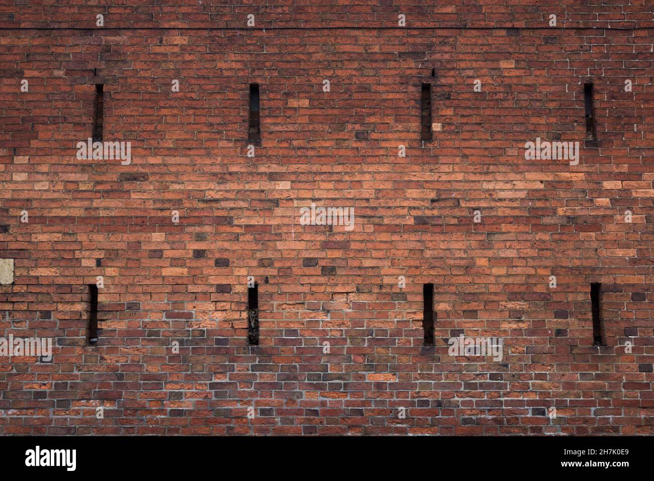 Abstract, Red Brick Building, Brick Exterior, Weeping Windows Stock Photo