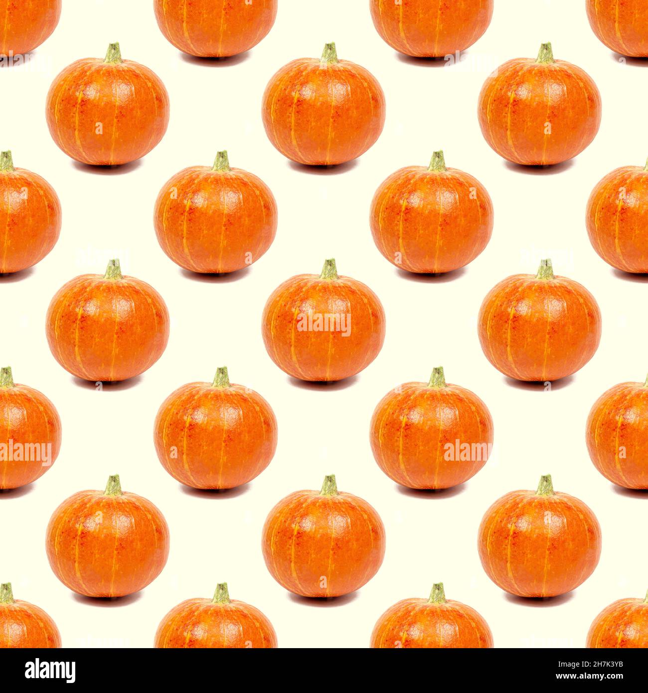 Yellow and orange pumpkin repeat seamless pattern on light background. Stock Photo