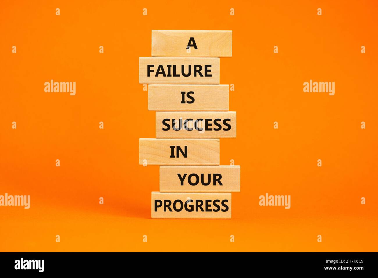 Failure or success symbol. Wooden blocks with words A failure is ...