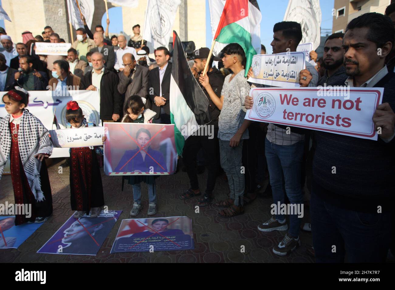 Rafah, Gaza. 23rd Nov, 2021. Palestinians hold posters depicting the crossed-out face of Britain's Home Secretary Priti Patel during a rally against Britain's possible designation of Hamas as a terror group, in Rafah in the southern Gaza Strip, on Tuesday, November 23, 2021. The United States designated Hamas as a terror group in 1995. Photo by Ismael Mohamad/UPI Credit: UPI/Alamy Live News Stock Photo