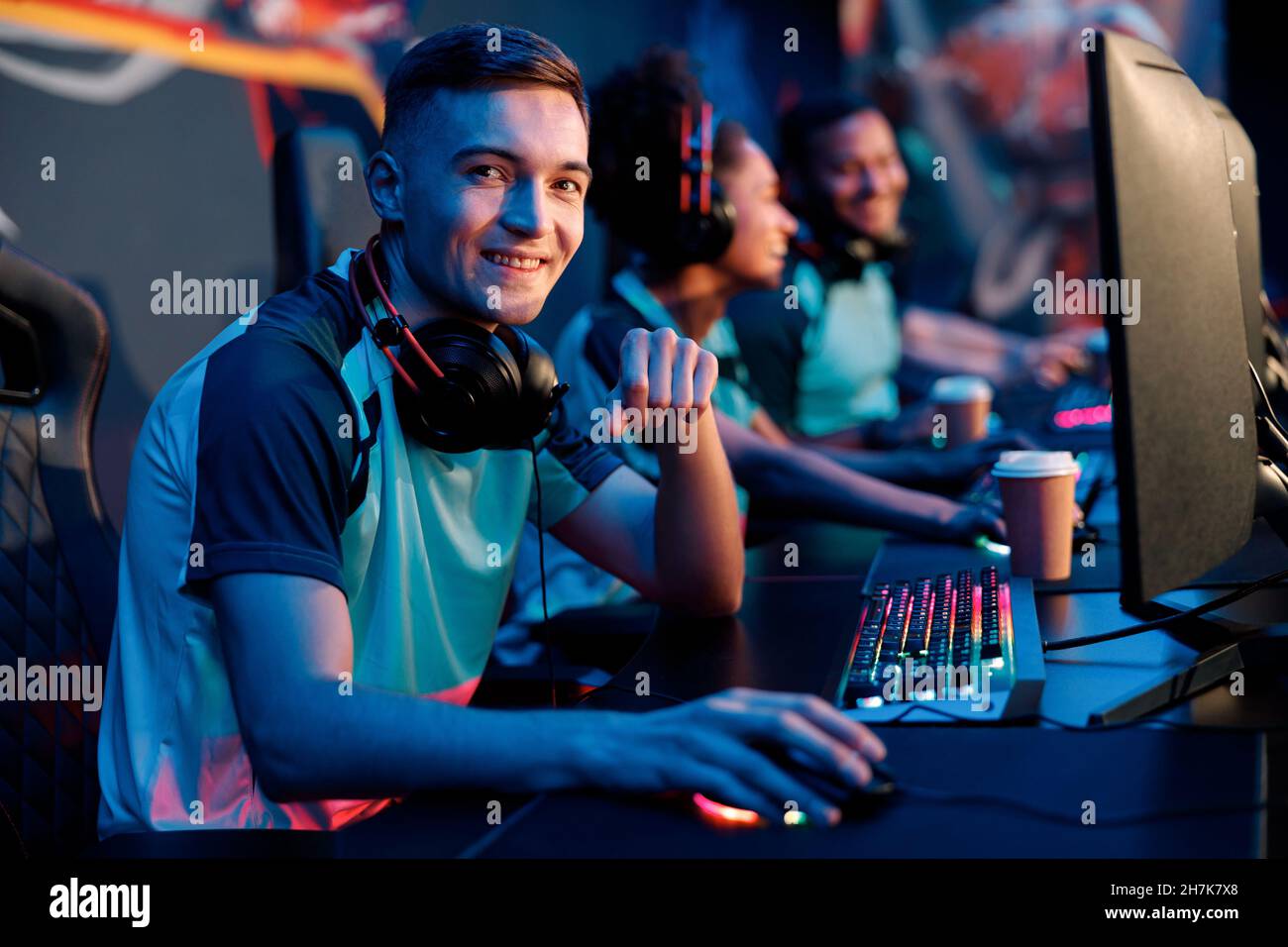 Smart gamer playing online video game professionally in computer club Stock Photo