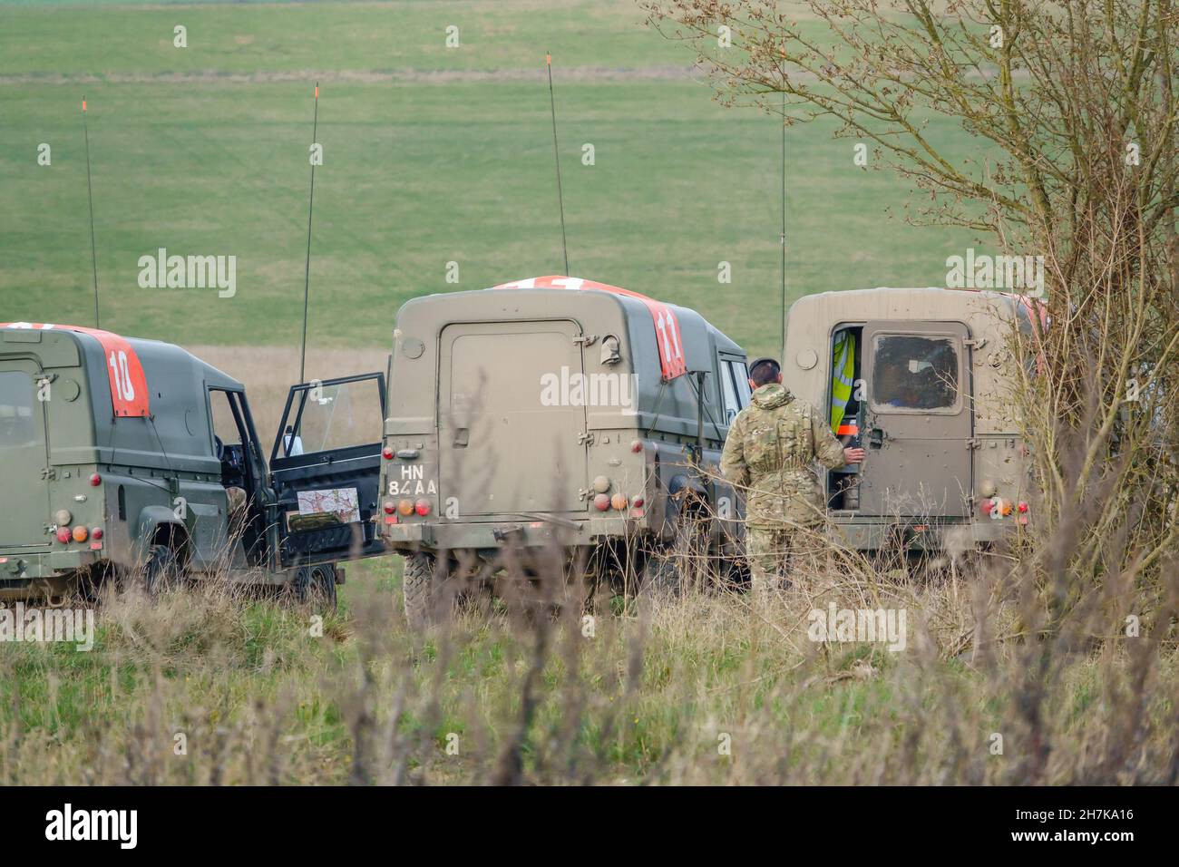 british army land rover defender wolf in action on a military exercise, Wiltshire UK Stock Photo