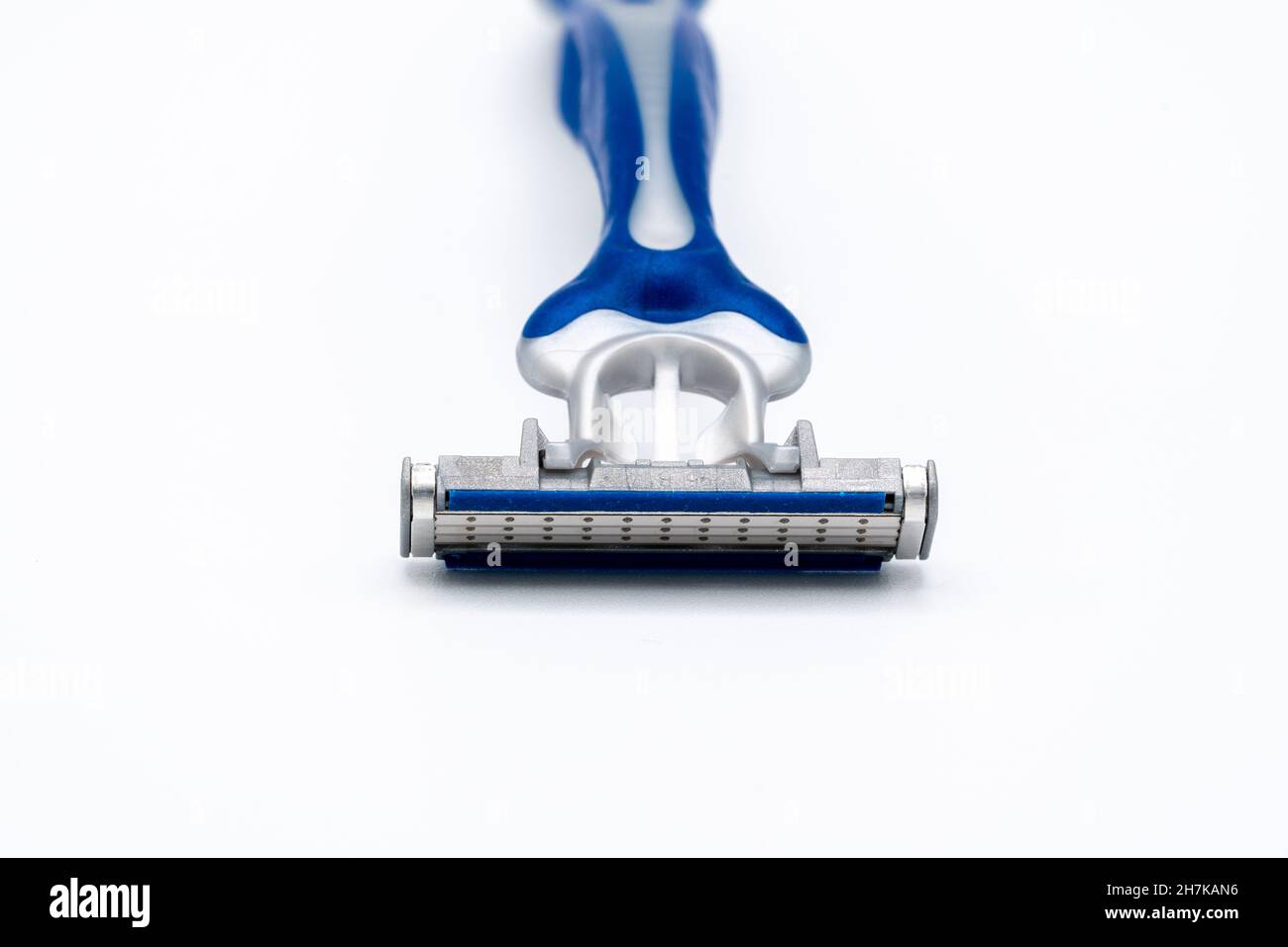 triple blade razor head in blue and gray colors on light background Stock Photo