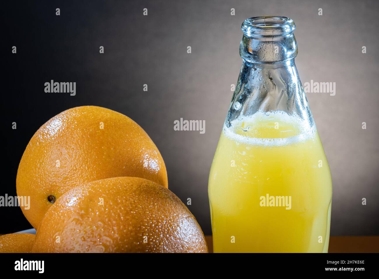 Helsinki / Finland - Closeup of moist oranges and glass bottle of orange  juice on the table Stock Photo - Alamy