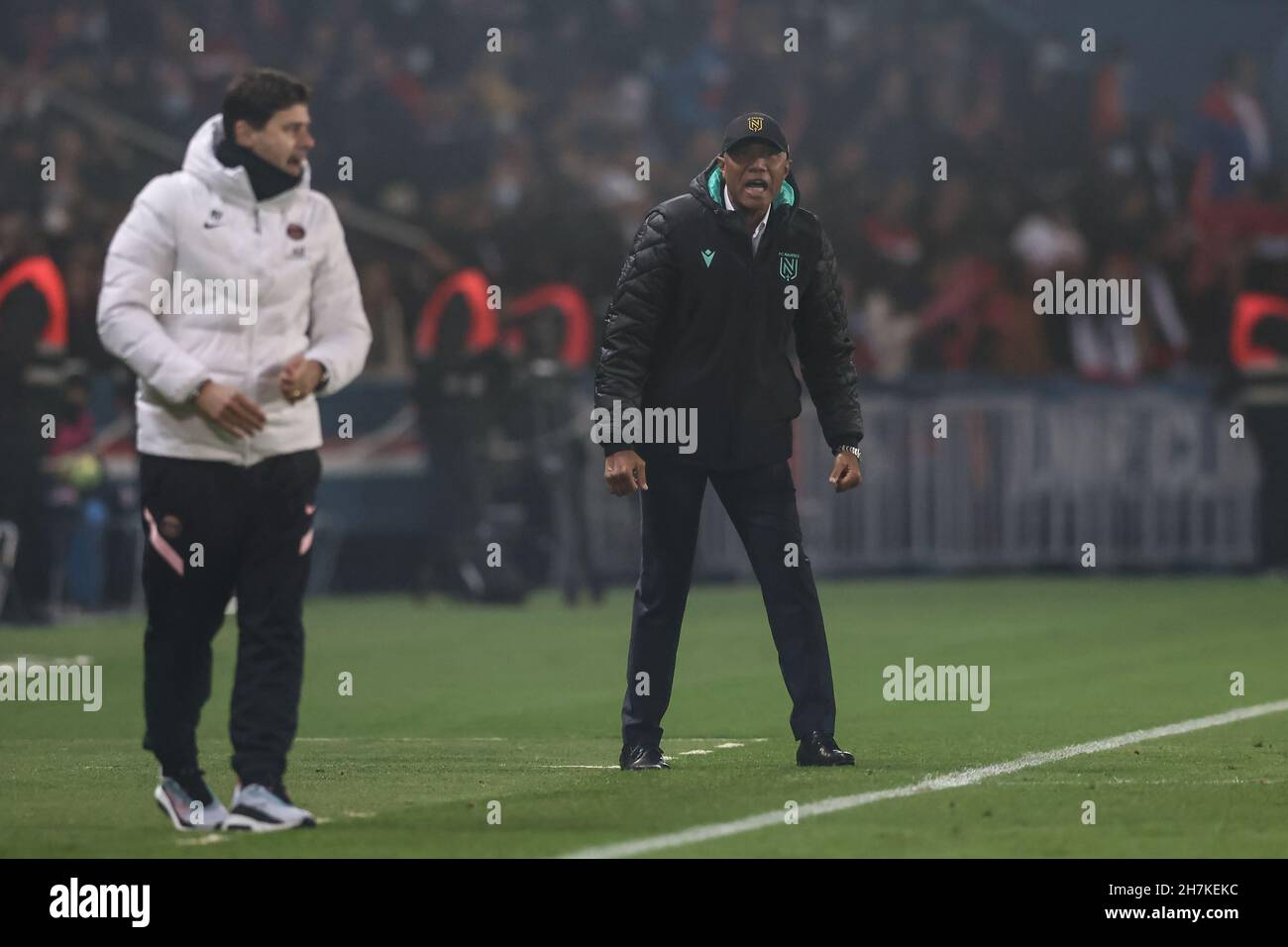 Paris, France, 20th November 2021. Antoine Kombouare Head coach of FC  Nantes reacts as Mauricio Pochettino Head coach of PSG looks on during the Ligue  1 match at Le Parc des Princes,