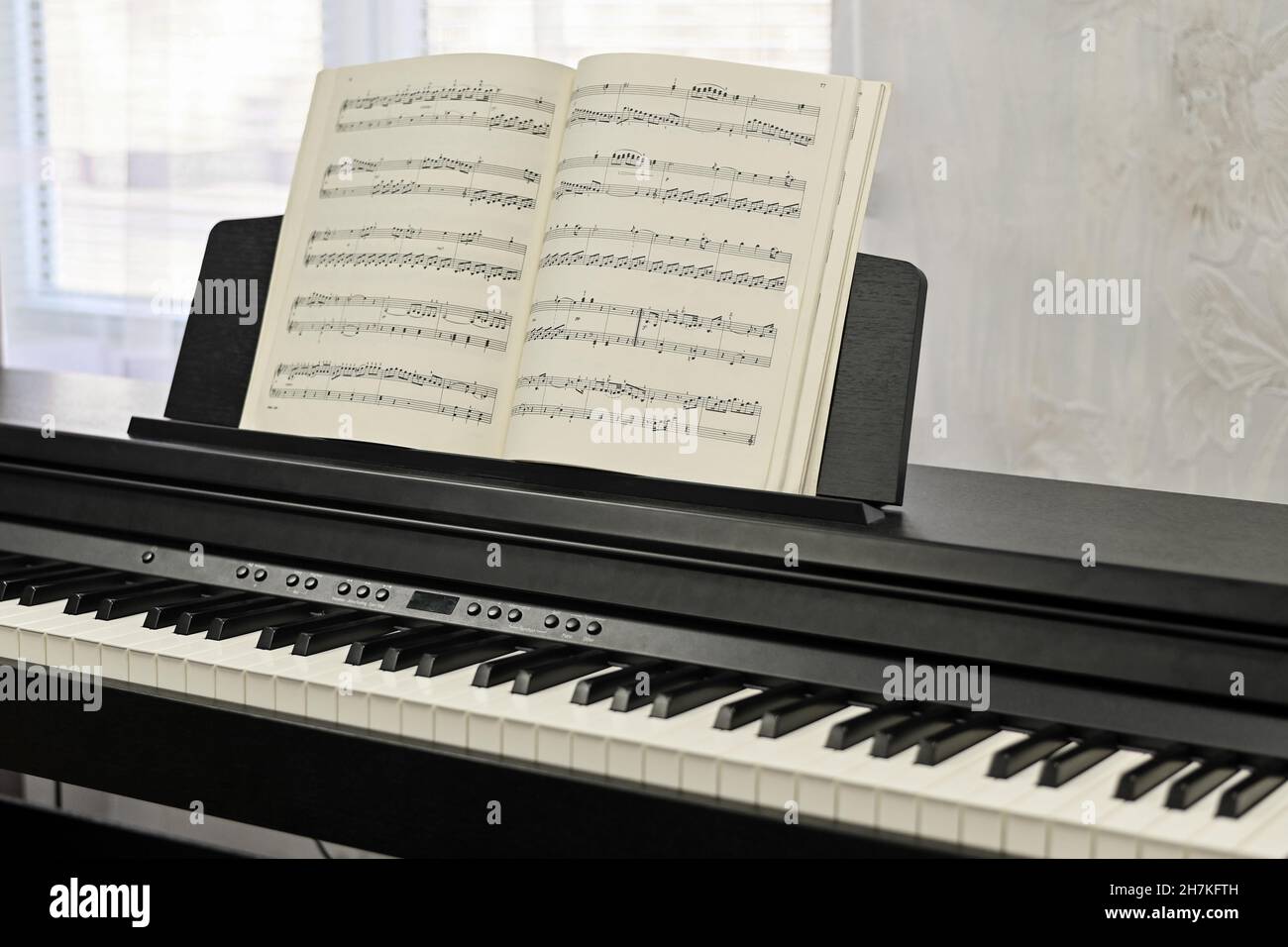Piano keys, sheet music. electronic piano at a music school Stock Photo