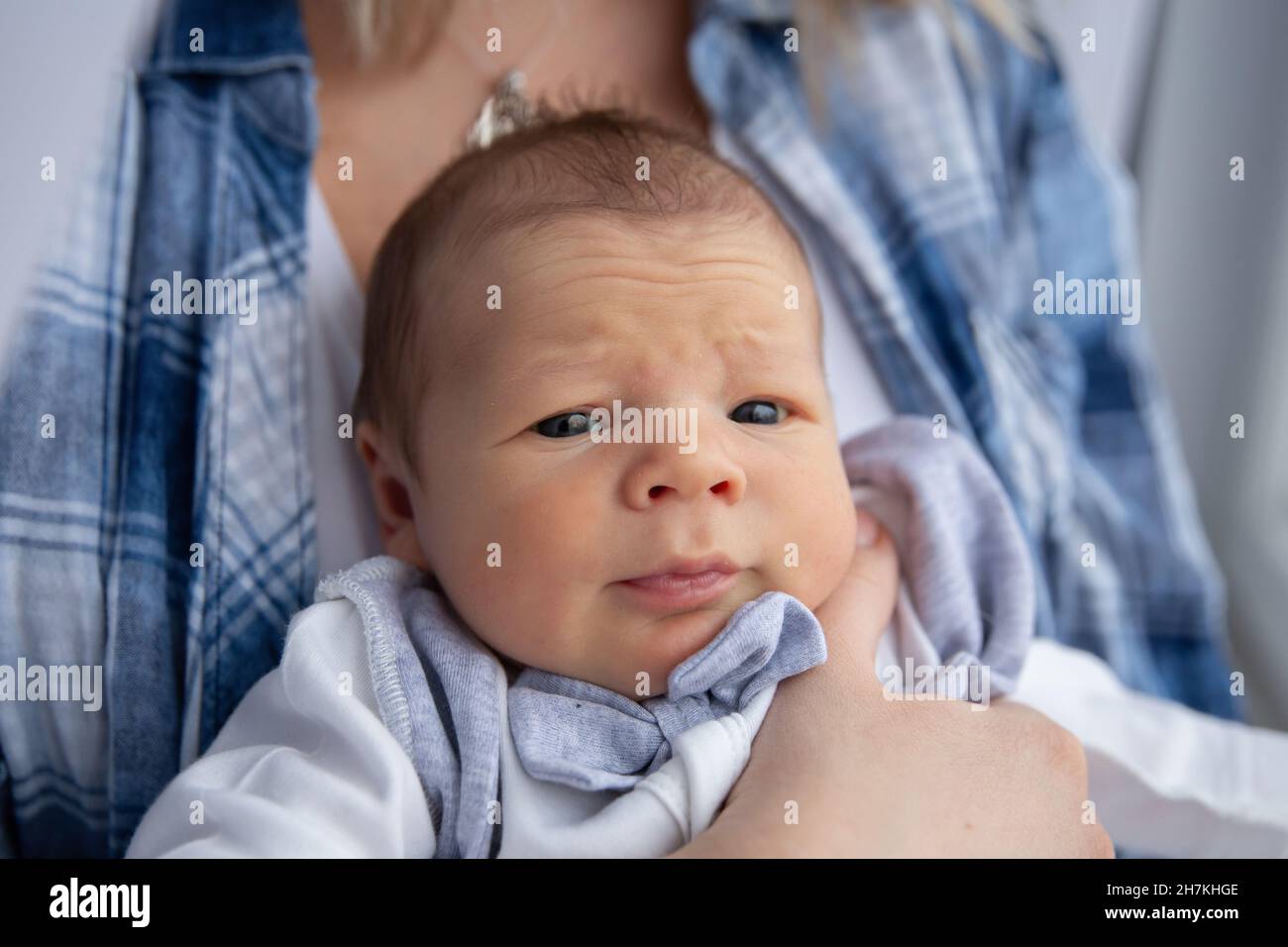 A newborn boy in his mother's arms Stock Photo Alamy