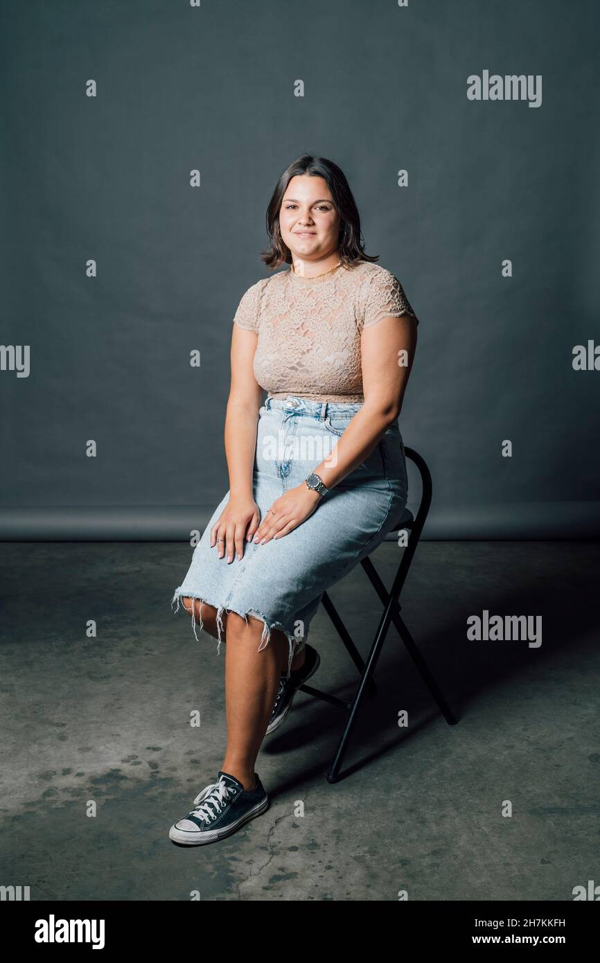 Woman in casuals sitting hi-res stock photography and images - Alamy