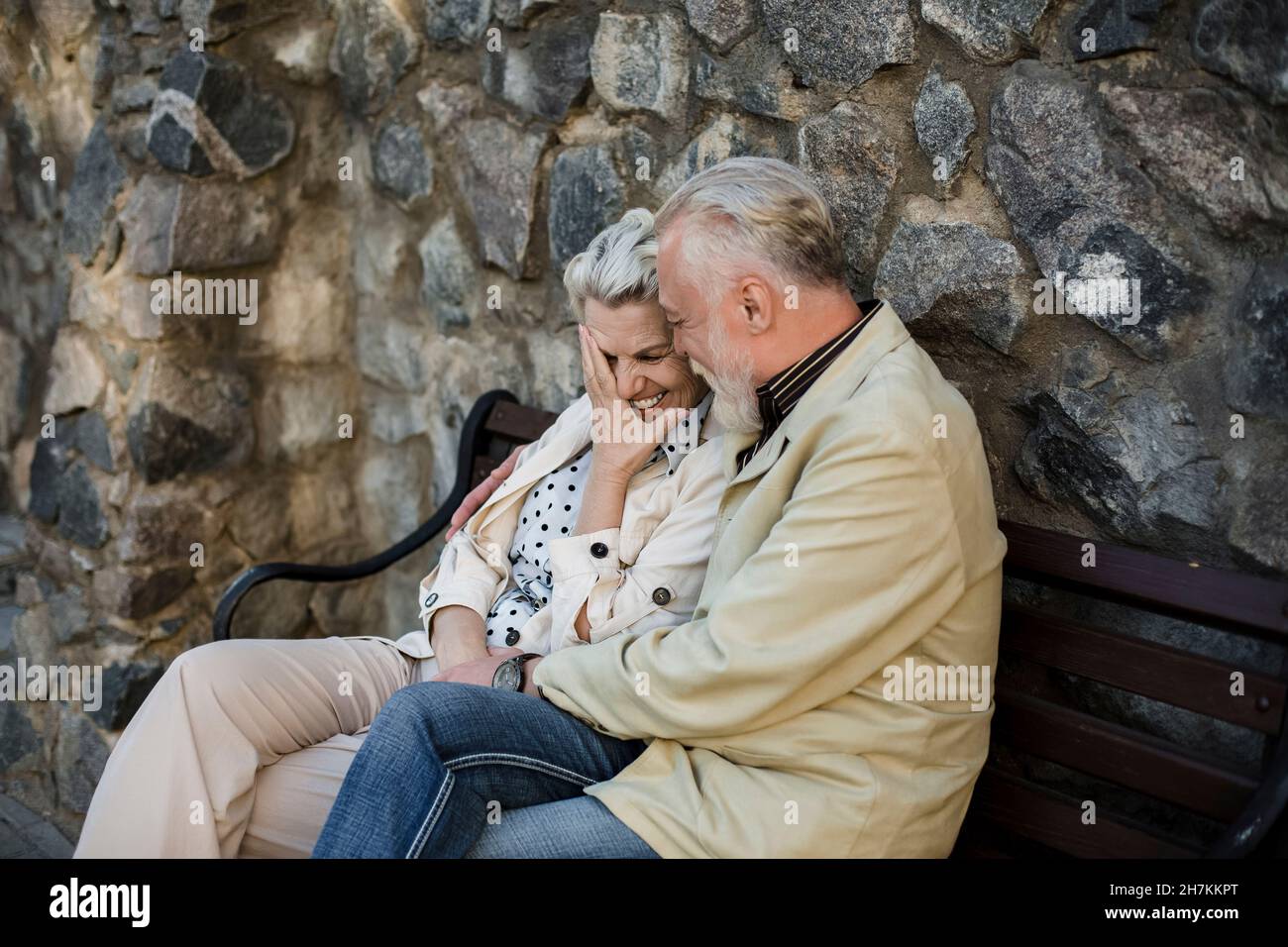 Man sitting on stone bench hi-res stock photography and images - Alamy