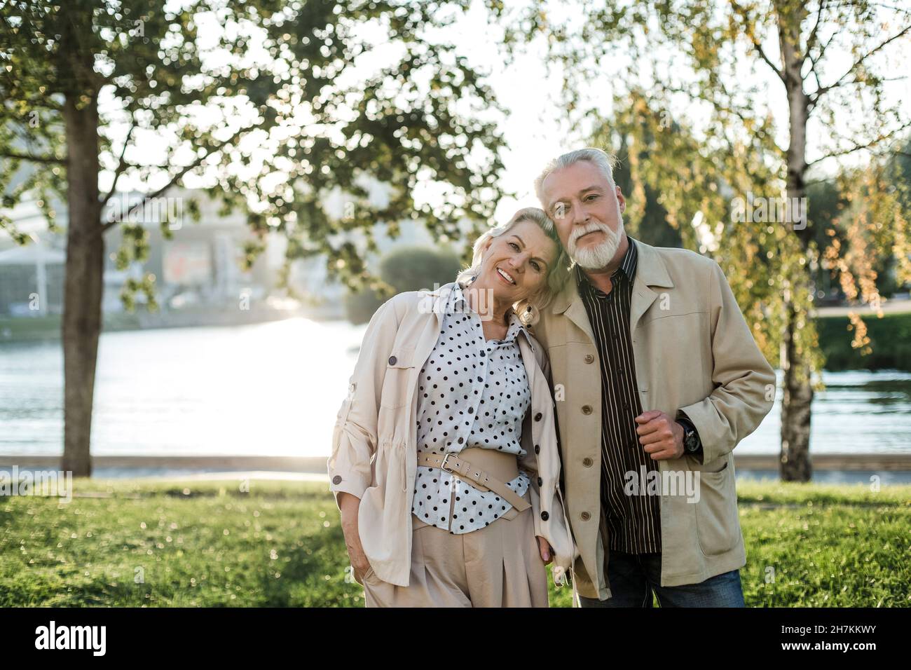Smiling woman leaning on man shoulder Stock Photo