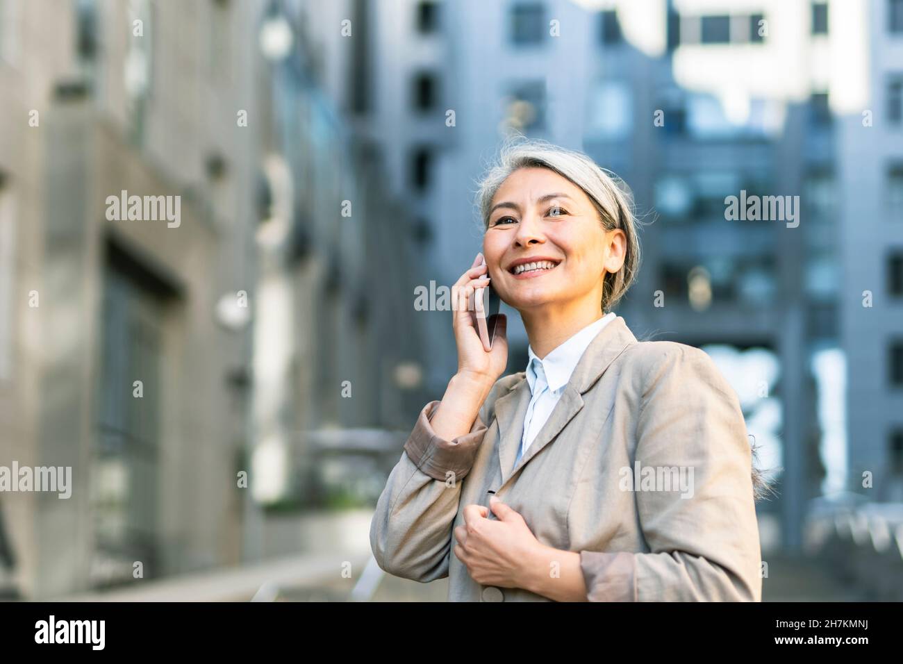 Positive asian woman talking hi-res stock photography and images - Alamy