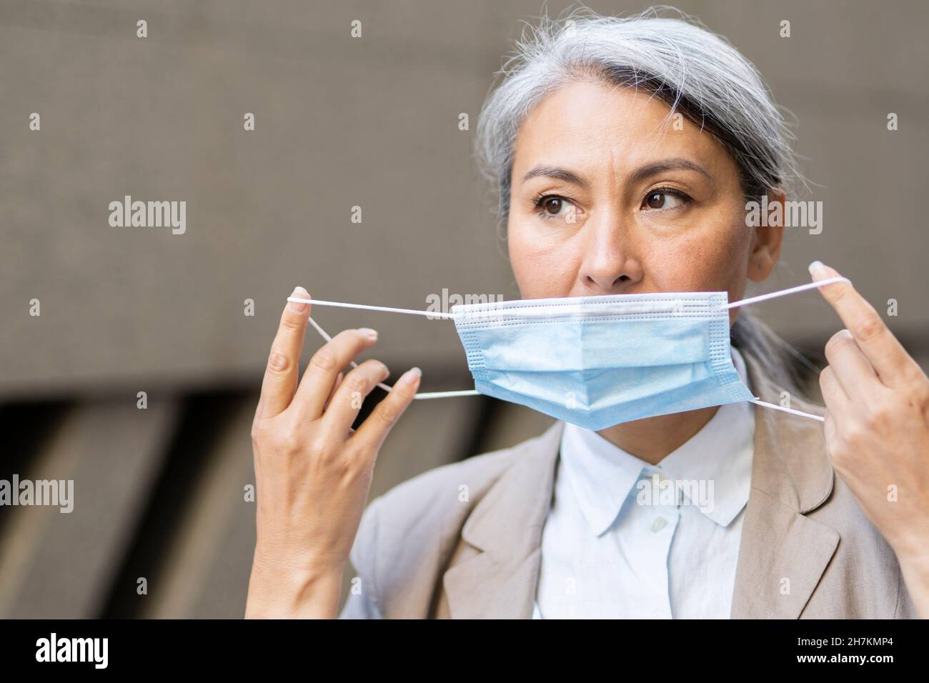 Mature woman wearing face mask hi-res stock photography and images - Alamy