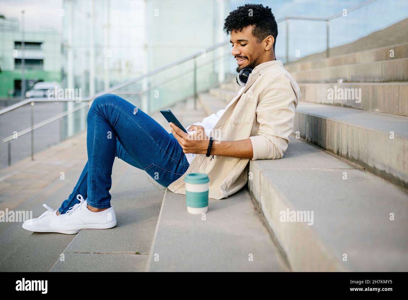 Man sitting stairs side view hi-res stock photography and images - Alamy