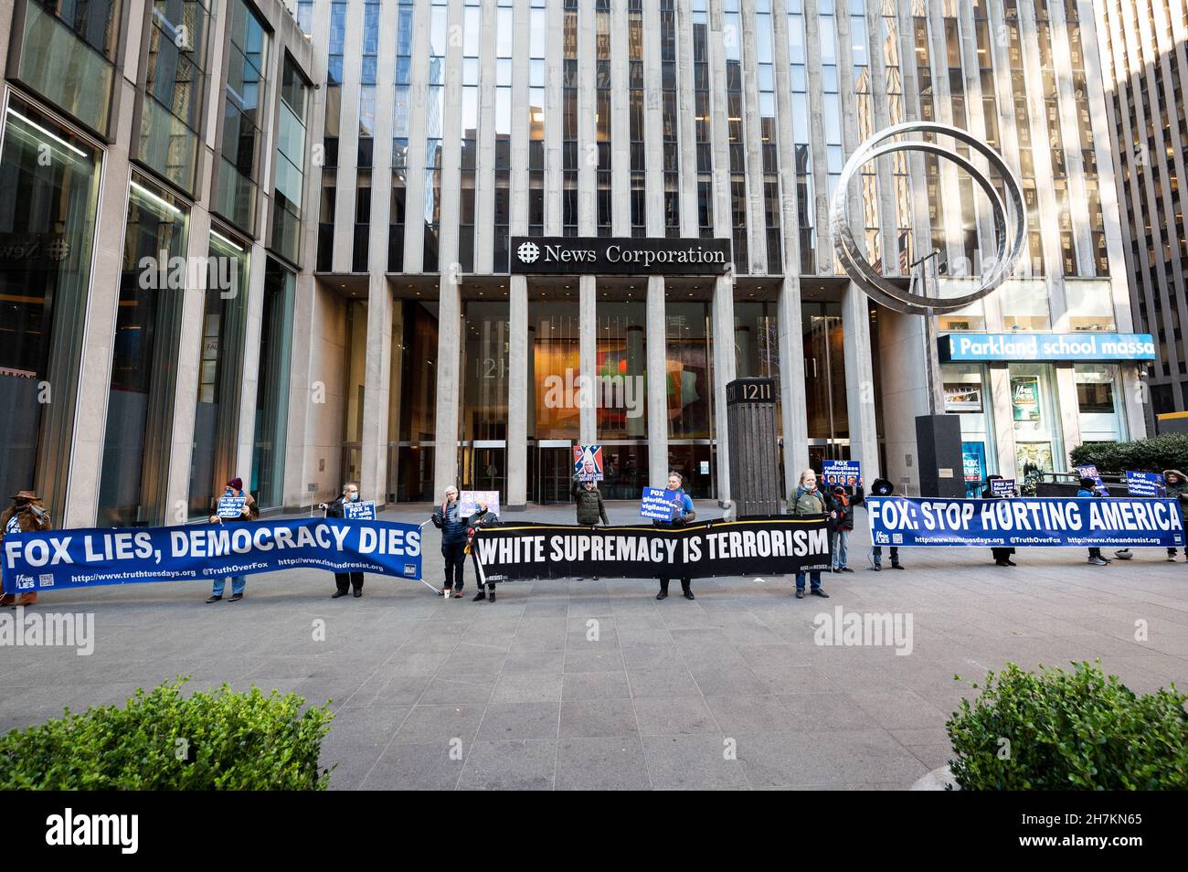 New York, United States. 23rd Nov, 2021. Protesters hold banners saying Fox lies, democracy dies, White Supremacy is terrorism and Fox: Stop hurting America during a protest against Fox News outside its building on Sixth Avenue. Credit: SOPA Images Limited/Alamy Live News Stock Photo