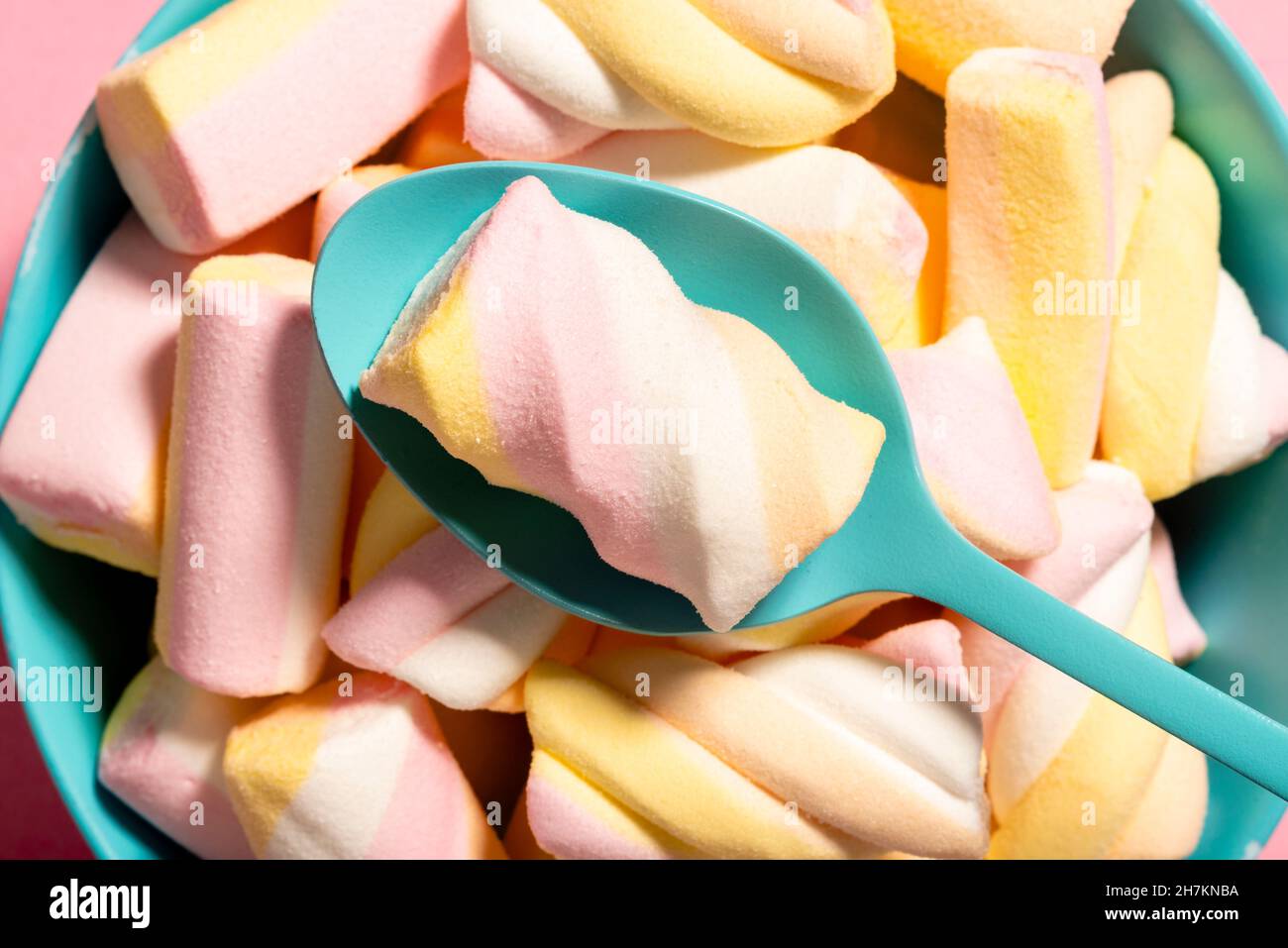 Marshmallow on spoon over bowl of marshmallows Stock Photo Alamy