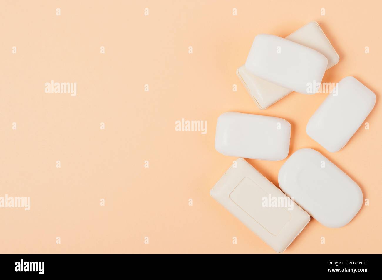 Variety of soap bars on peach background Stock Photo Alamy