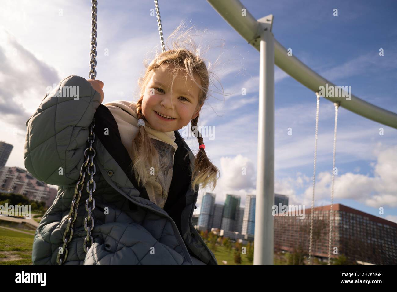 Blond girl on swing hi-res stock photography and images - Alamy