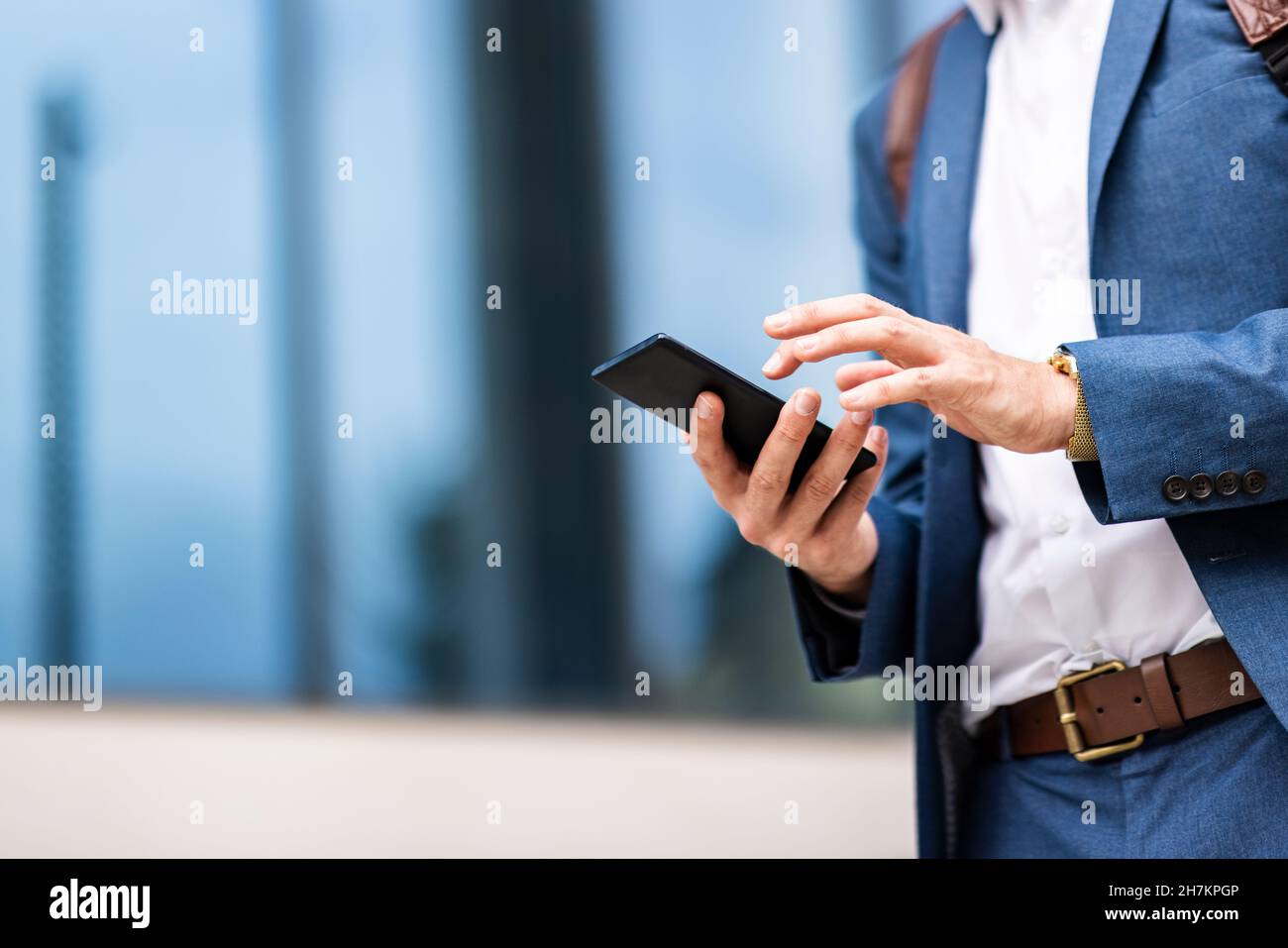 Young male professional using smart phone Stock Photo